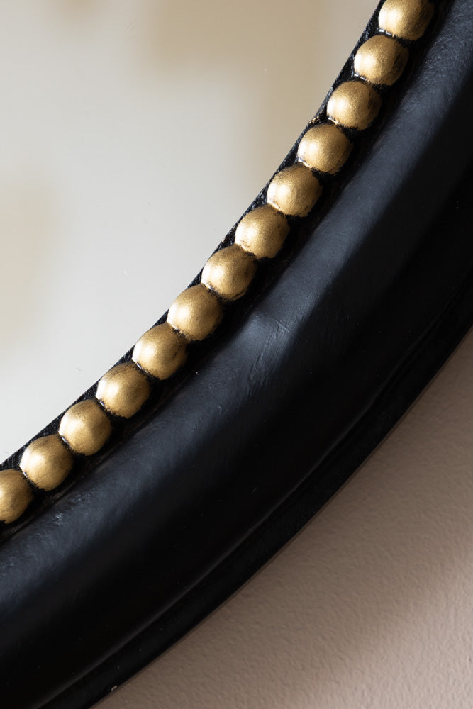 Miroir mural rond avec nœud noir et or