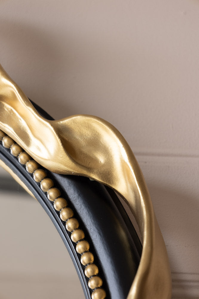 Miroir mural rond avec nœud noir et or