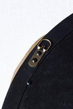 Miroir mural rond avec nœud noir et or