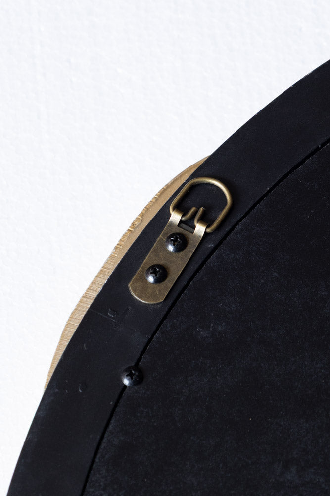 Miroir mural rond avec nœud noir et or