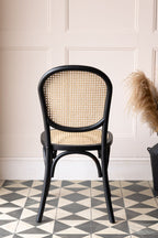 Chaise de salle à manger en bois noir et canne tressée Chez Pitou