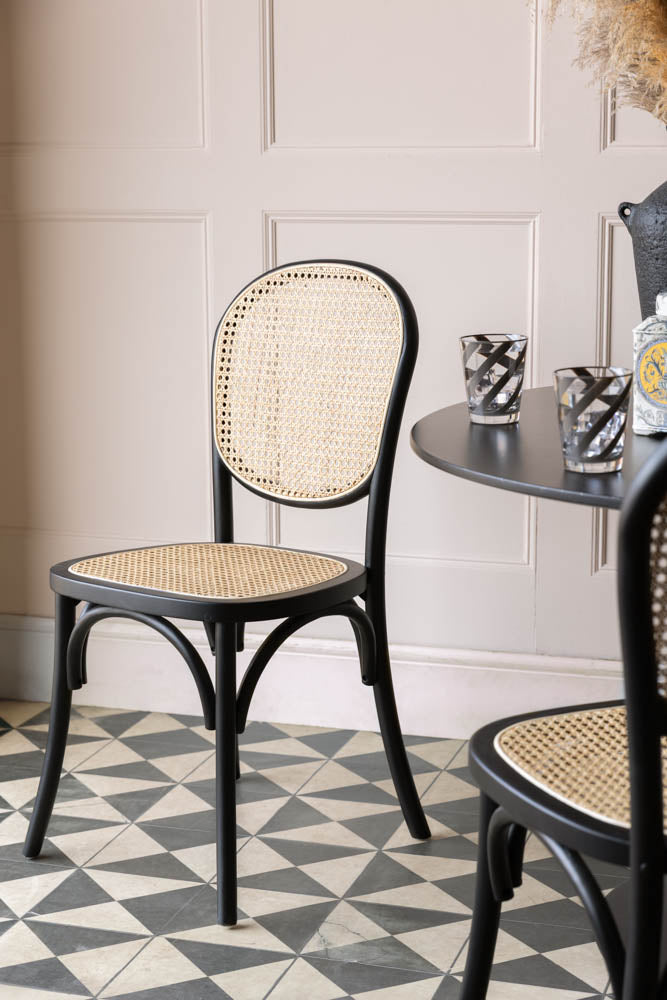 Chaise de salle à manger en bois noir et canne tressée Chez Pitou