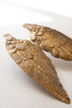 Décoration de bougie en métal ailé doré