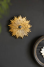 Décoration murale dorée contre le mauvais œil