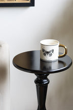 Table d'appoint noire en bois tourné